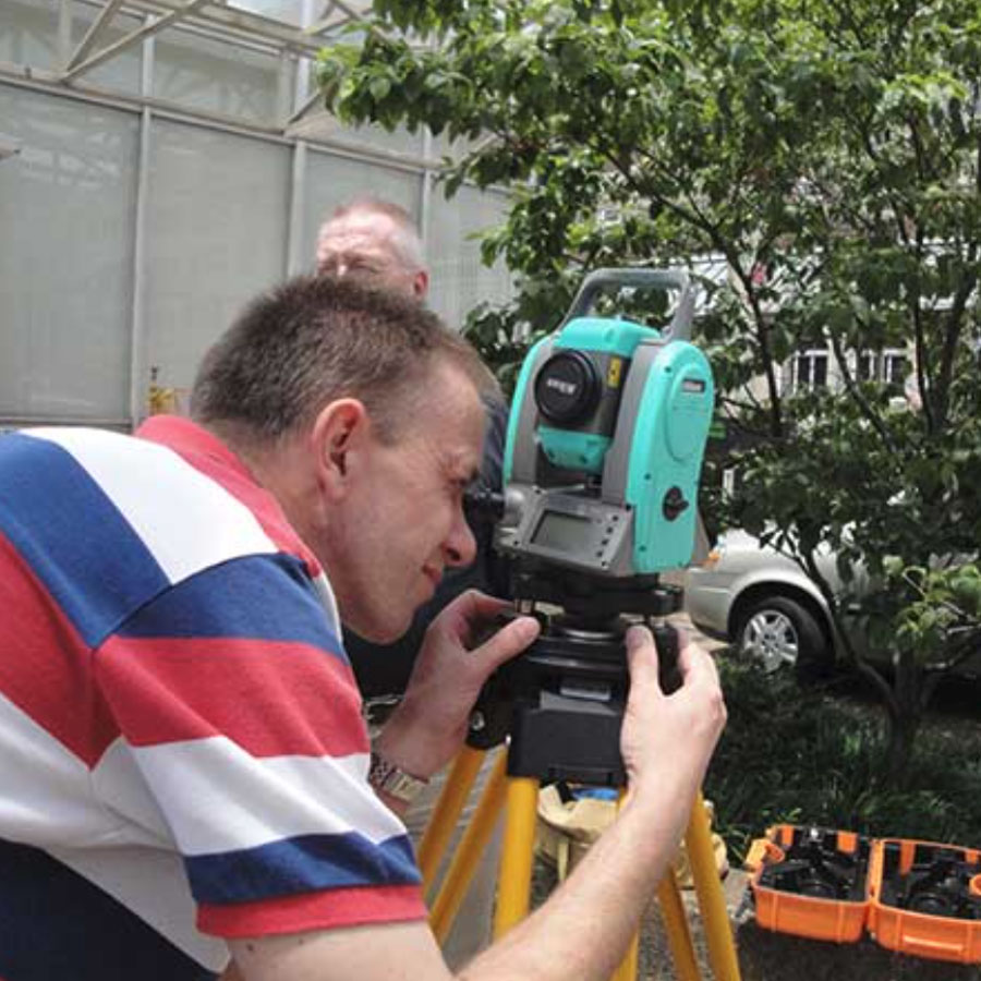 A picture of a person using traffic data collection equipment from the Center for Transportation Research at UT.