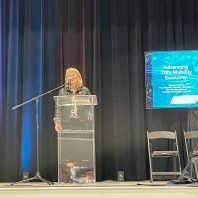 Deb Crawford speaks at a podium
