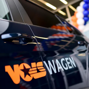 Car with a decal saying "VolsWagen"