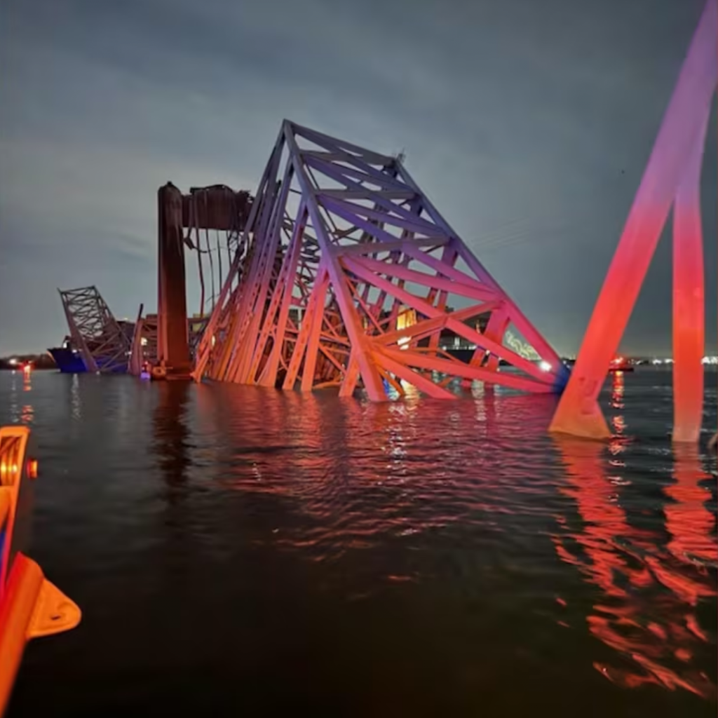 Photo of the fallen bridge half submerged in the river