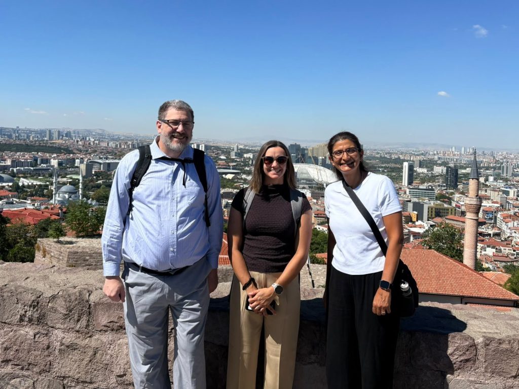 Kevin, Marcella, and Merih in a photo outdoors