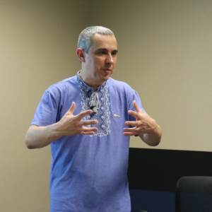 bondarenko speaking at the front of a room